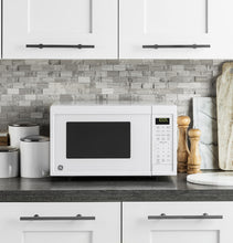 Load image into Gallery viewer, GE® 0.9 Cu. Ft. Capacity Countertop Microwave Oven
