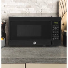Load image into Gallery viewer, Black GE Appliances 17.3125&#39;&#39; 0.7 Cubic Feet cu. ft. Countertop Microwave
