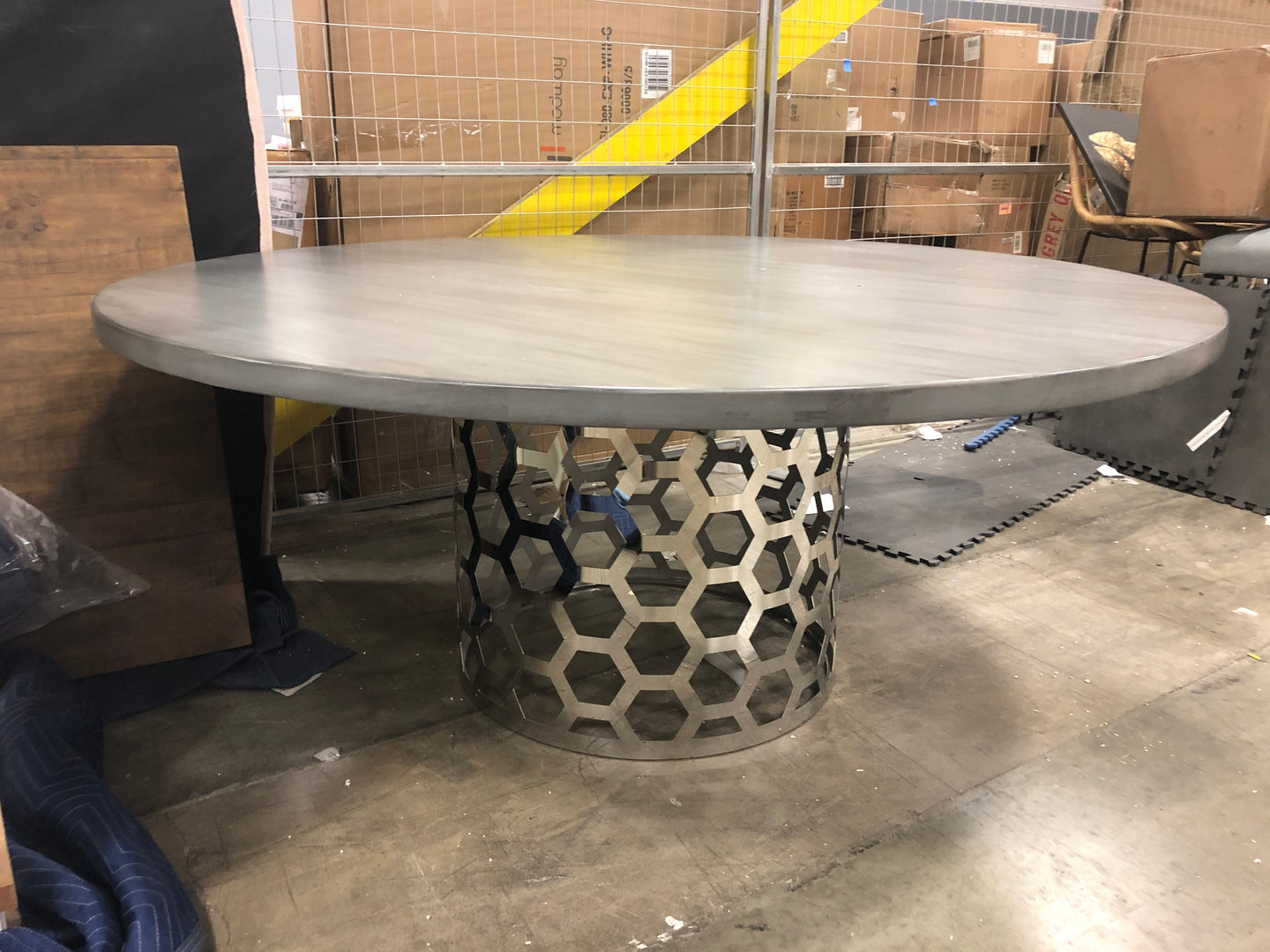 Gray round table with metal honeycomb base