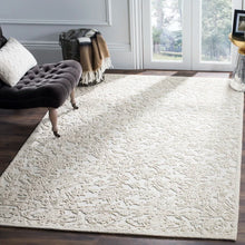 Load image into Gallery viewer, Marys Handmade Tufted Wool Area Rug in Ivory, Rectangle 6&#39; x 9&#39;
