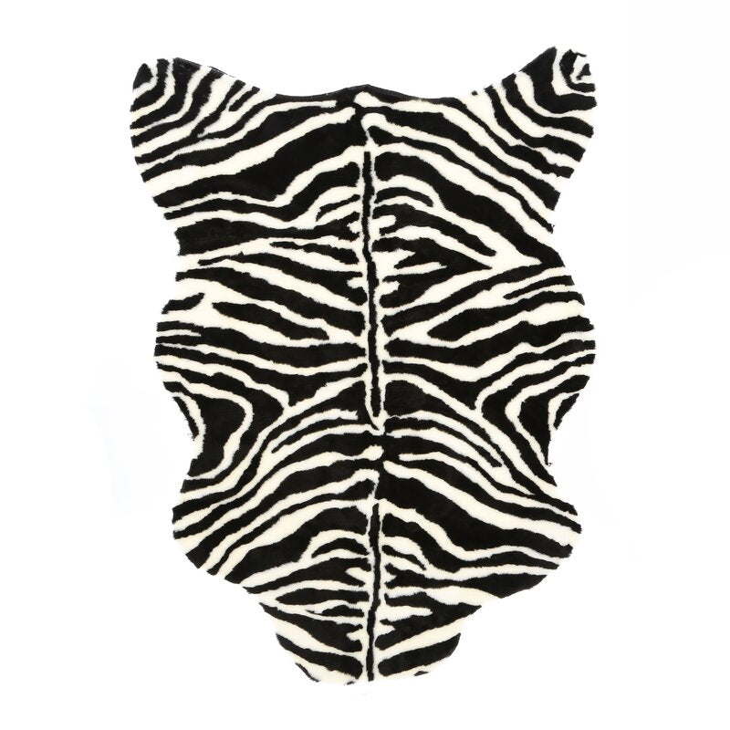 Polak Animal Print Black / White Area Rug