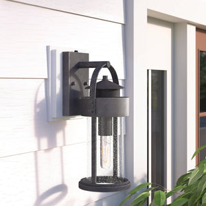 16.25" H x 6" W x 7.75" D Pranay Rust Iron 1 - Bulb Seeded Glass Outdoor Wall Lantern with Dusk to Dawn