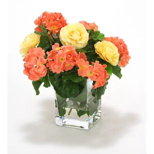 Primrose and Ranunculas Centerpiece in Vase