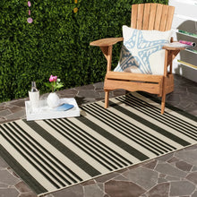 Load image into Gallery viewer, SAFAVIEH Courtyard Charmaine Indoor/ Outdoor Area Rug - 5&#39;3&quot; x 7&#39;7&quot; - Black/Bone
