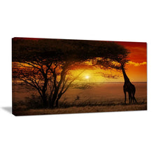 Load image into Gallery viewer, Typical African Sunset With Giraffe - Wrapped Canvas Photograph, 16&quot; H x 32&quot; W x 1&quot; D
