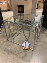 Load image into Gallery viewer, Coffee table with glass top and silver base
